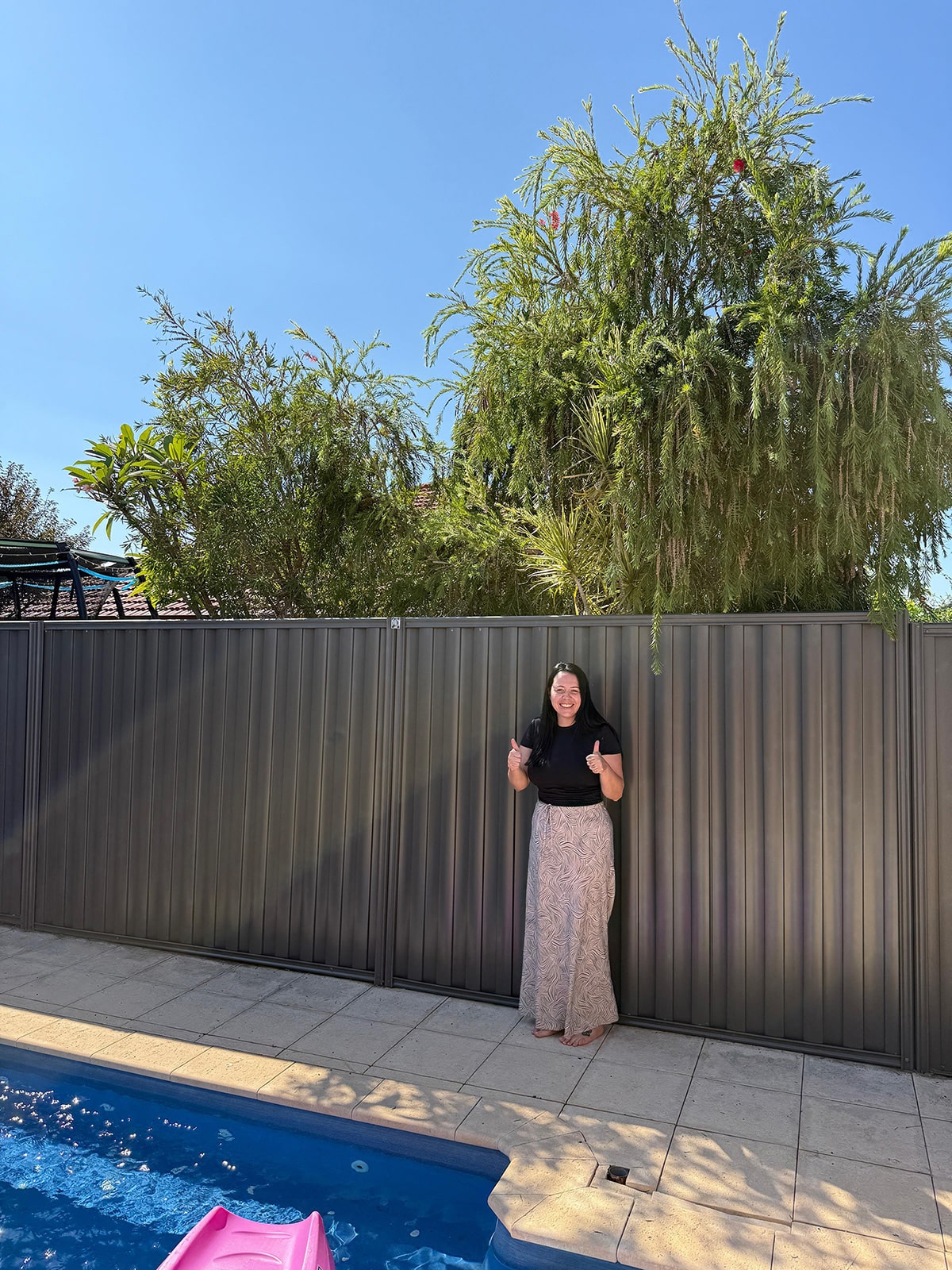 Modern fence design with wooden panels